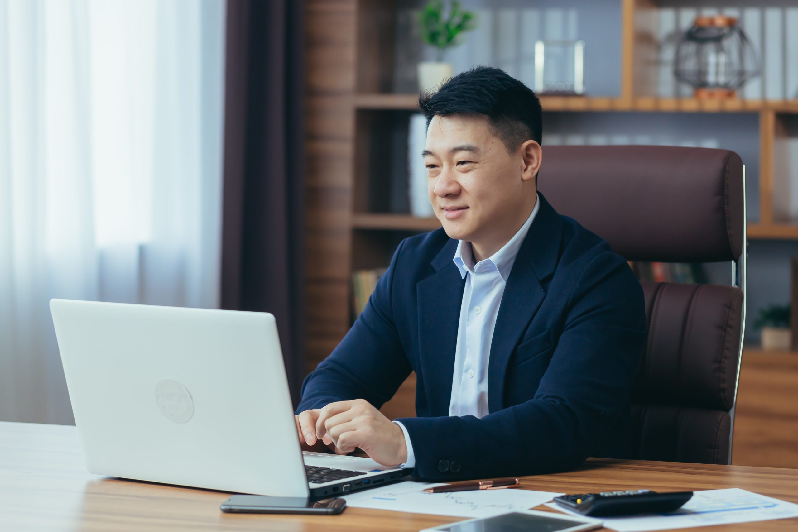 lawyer talking to client on computer through video conferencing 