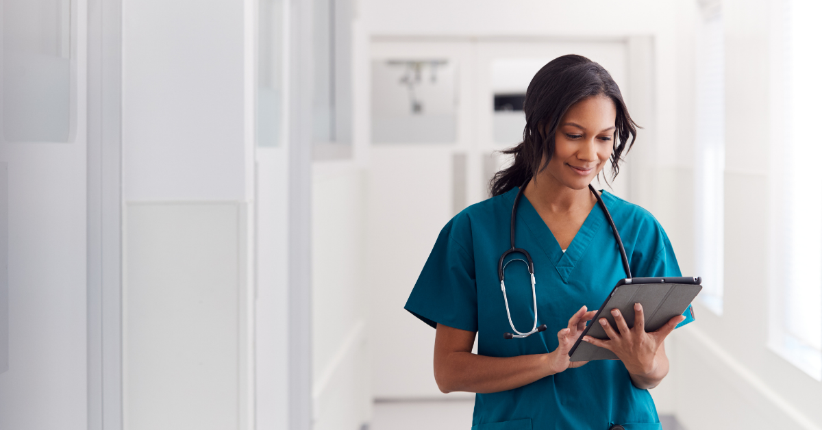 A doctor using a telemedicine-enabled platform to contact patients using a tablet