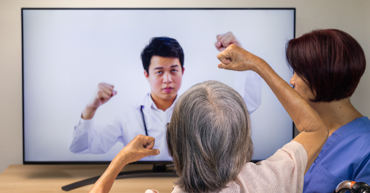 Elderly woman receiving physical therapy on a video call