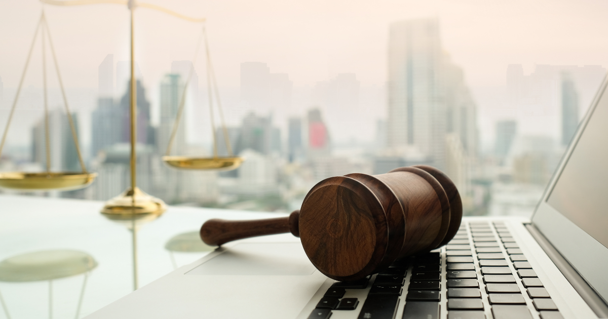 Desk with gavel on a laptop keyboard using a virtual Court Solution