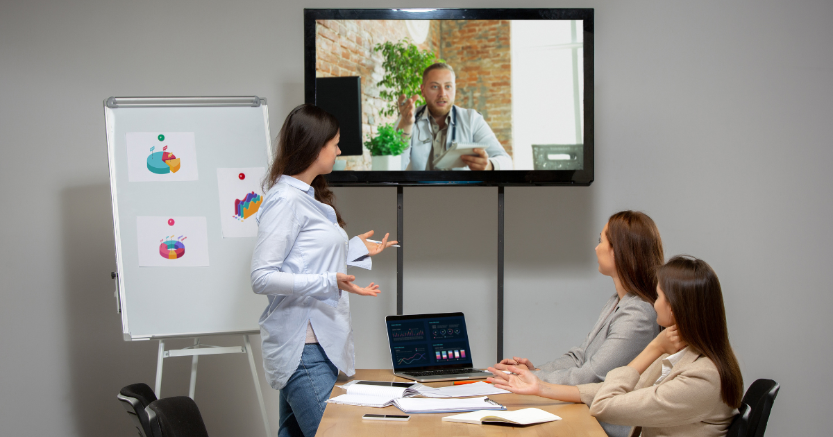 Team hosting a business video conference with a client