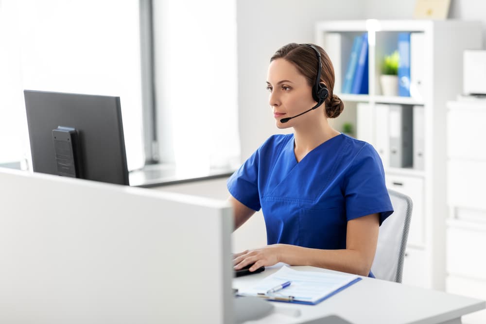 A female nurse being a virtual sitter