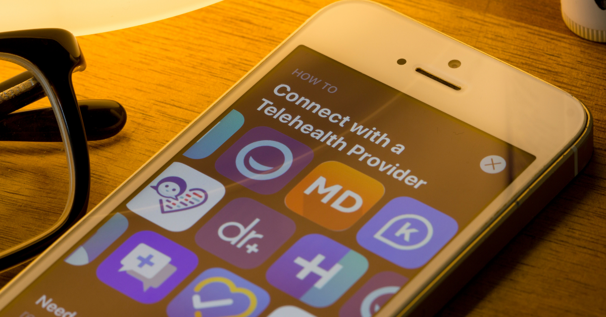 Close up of phone screen with medical icons, emphasizing what is telehealth