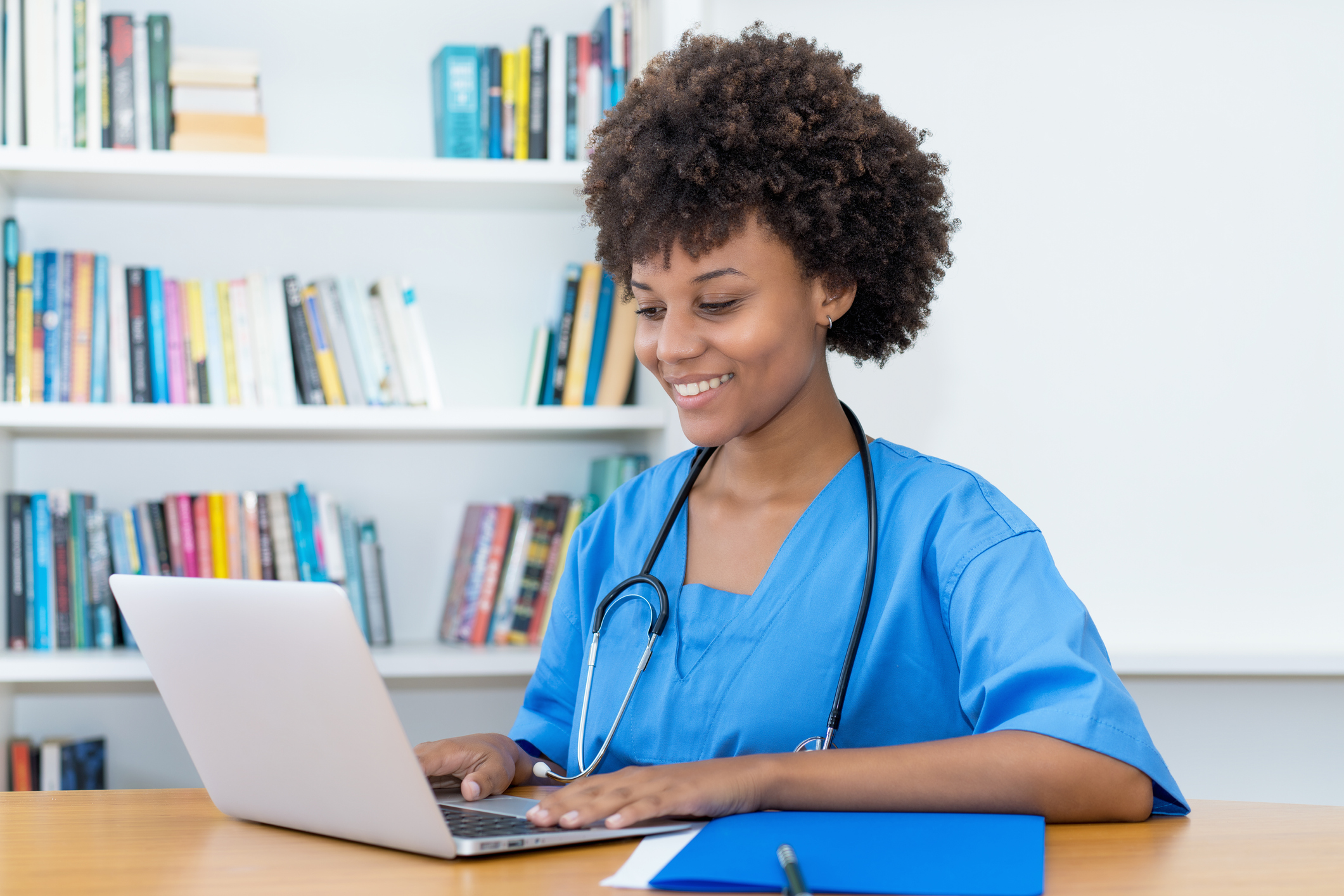 nurse looking into computer