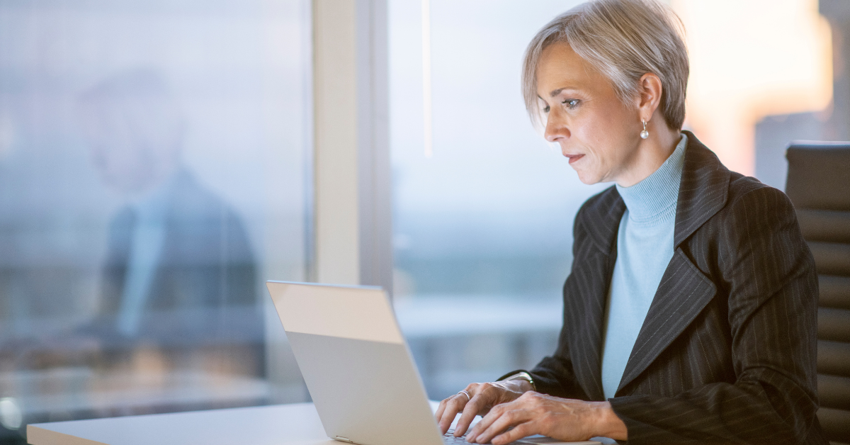 business womam looking at her laptop