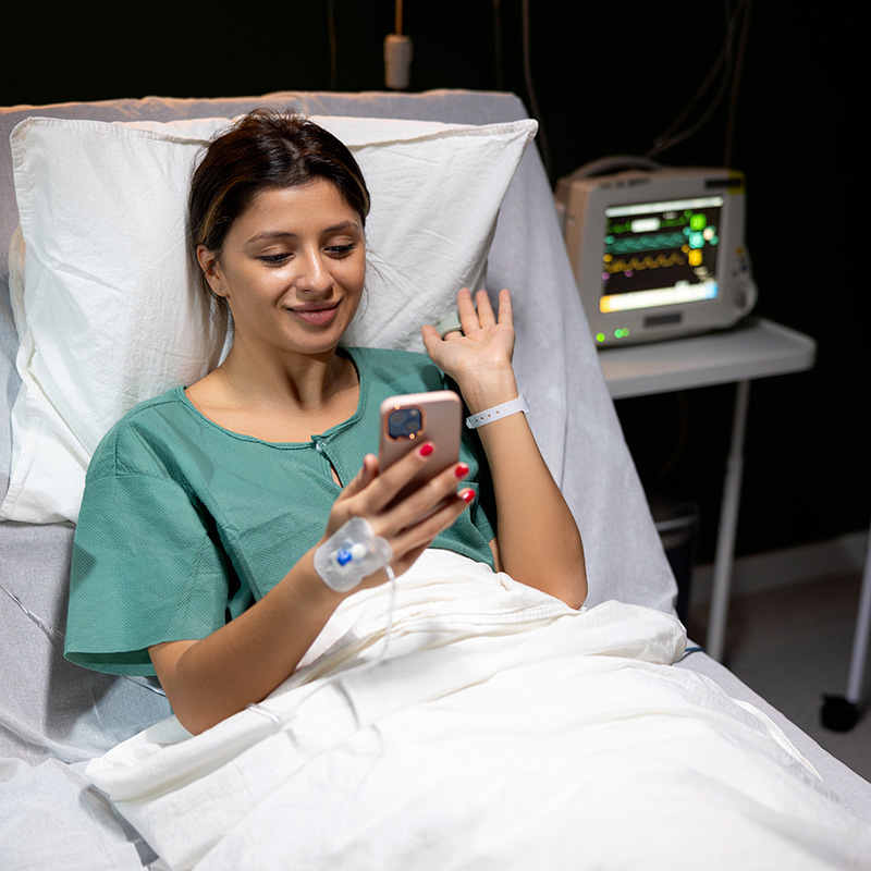 Patient in hospital bed.