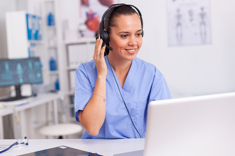 A female nurse being a virtual sitter