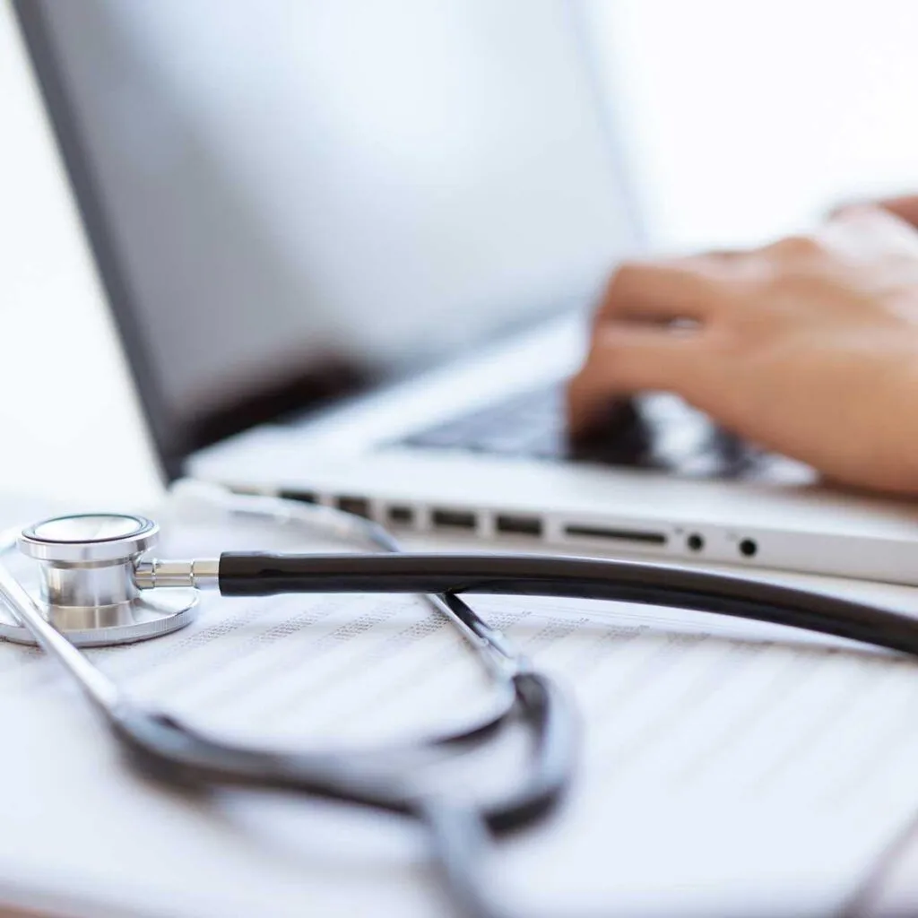 Capture-and-Stream-Live-Grand-Rounds-4-1024x1024 Medical system integration concept with stethoscope and laptop for seamless healthcare technology access